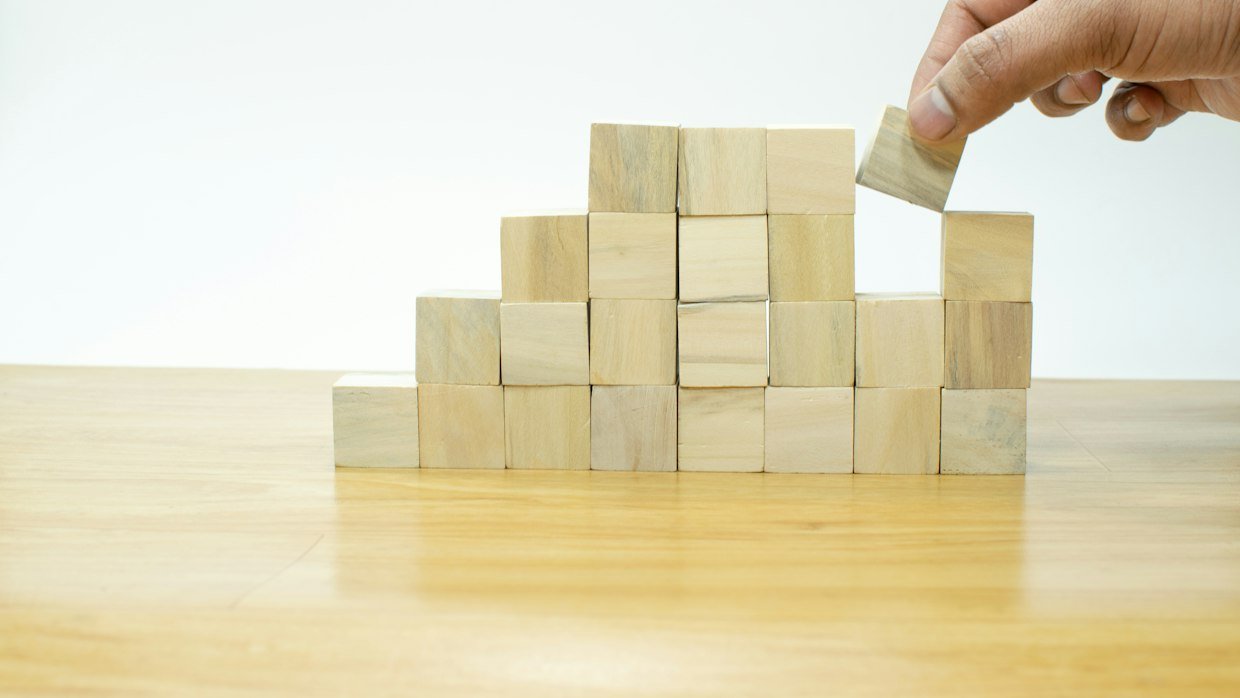 Numbered wooden blocks arranged in order.
