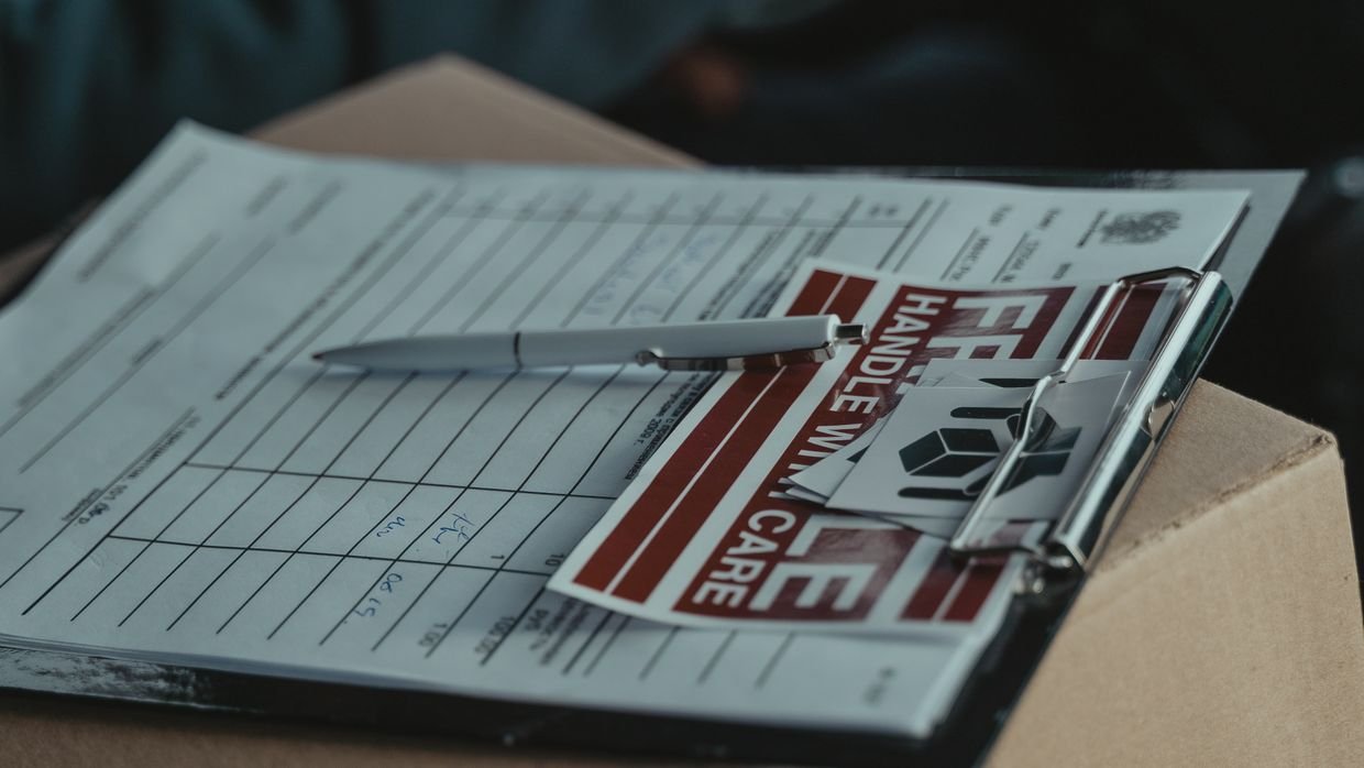 A printed running order held on a clipboard.