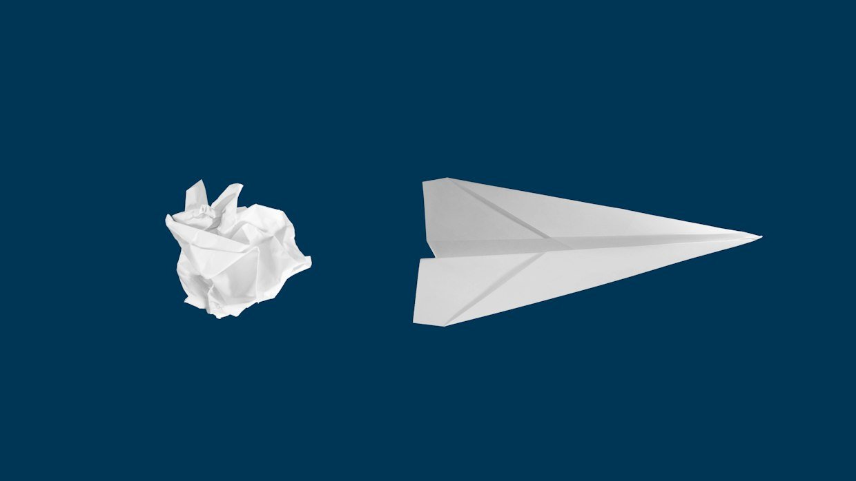 A paper aeroplane in flight.