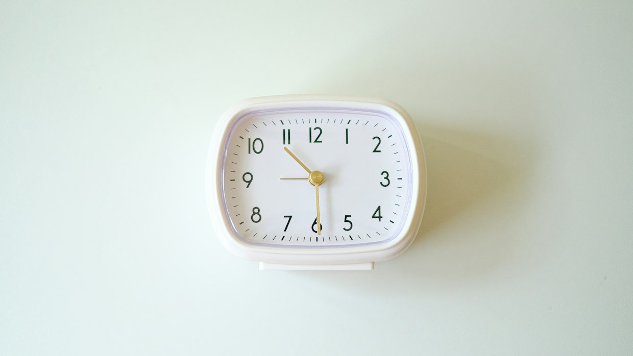 A clock on a studio wall, for the wait before a stream recording is captioned.