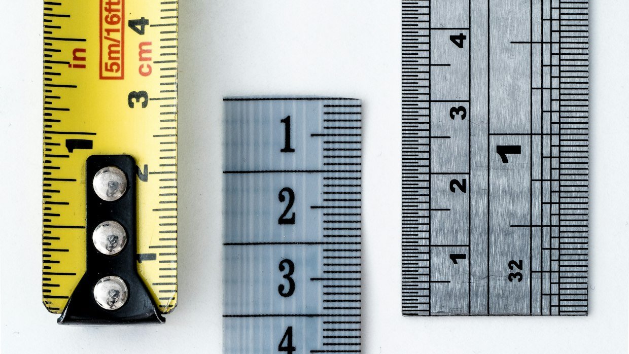A measuring tape stretched across a surface.