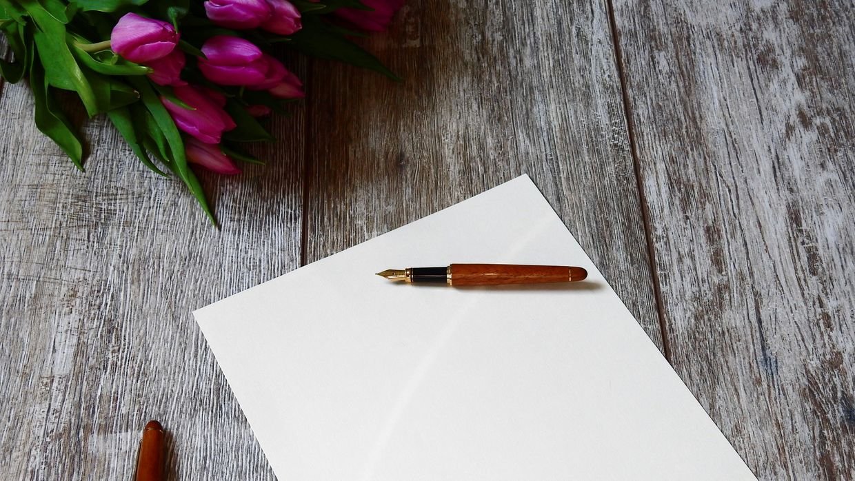 A blank sheet of paper with one pen.