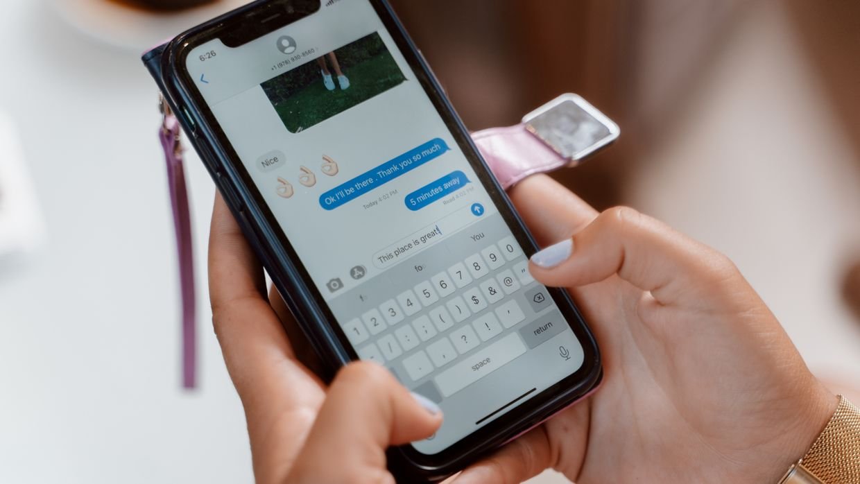 A thumb selecting text on a phone, which makes copying a long transcript awkward.