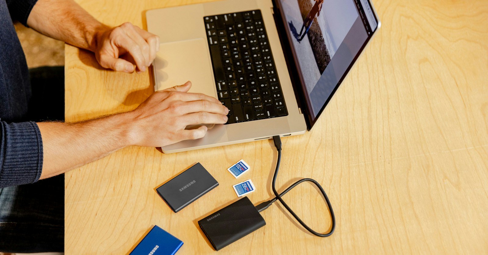 An external hard drive next to a laptop.
