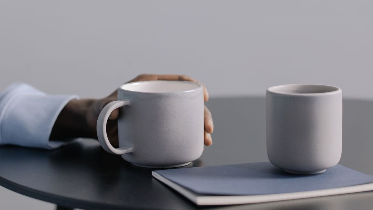 Two mugs placed side by side on a table.