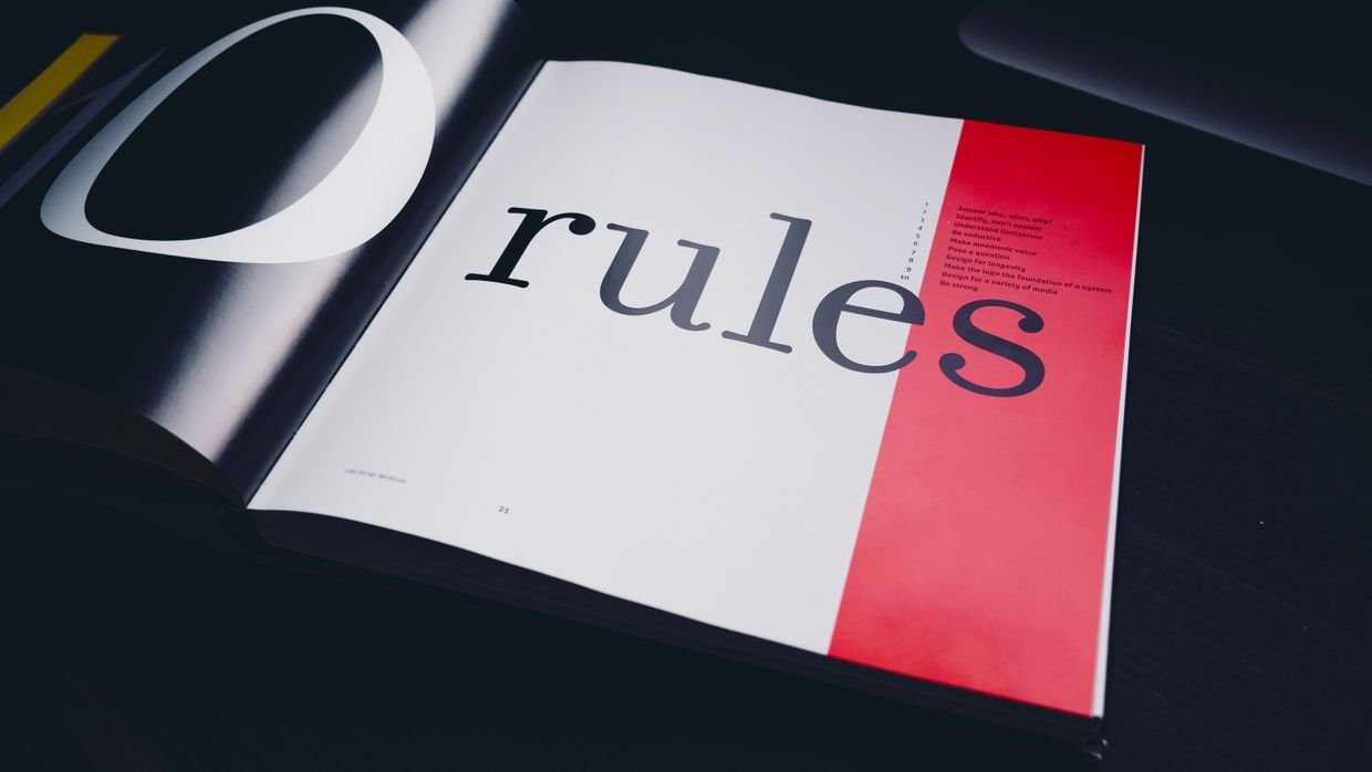 A printed manual open at a page of rules.