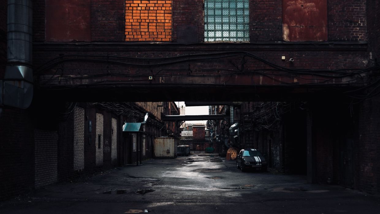 A passage ending at a blank wall.