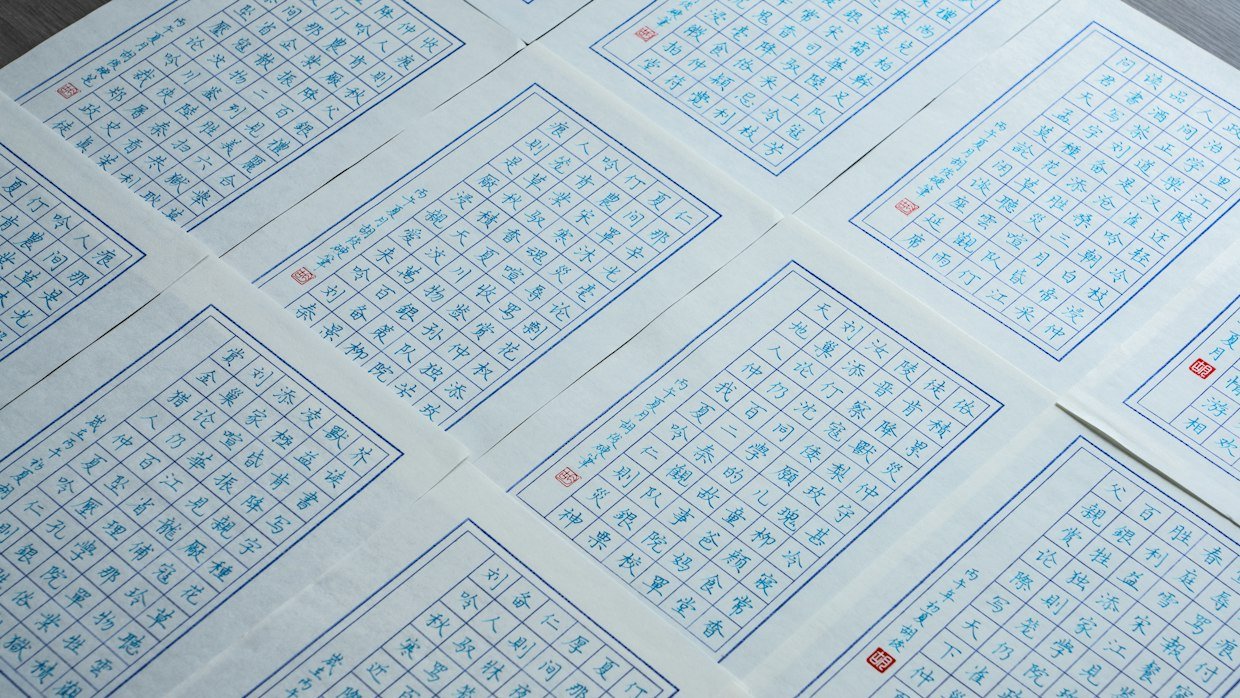 A printed grid of comparisons on paper.