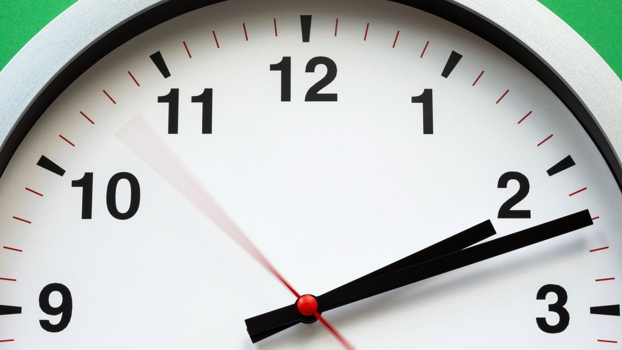 A clock face showing the second hand.