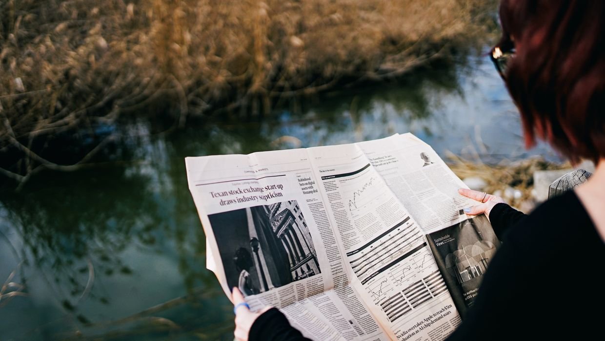 Four newspapers laid out side by side.