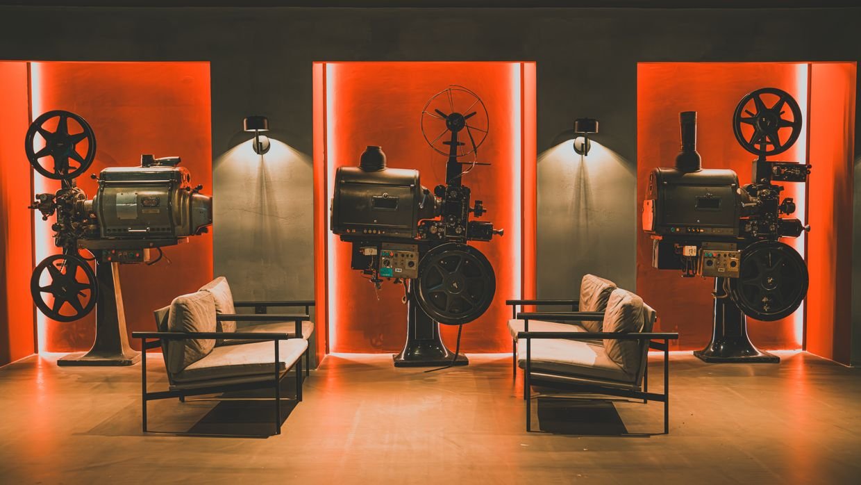 A film projector running in a dark room.