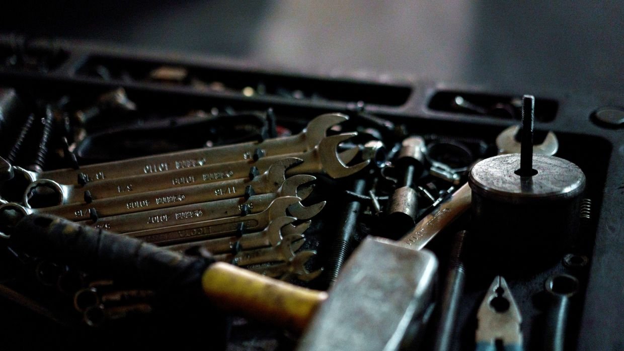 An open toolbox holding various tools.
