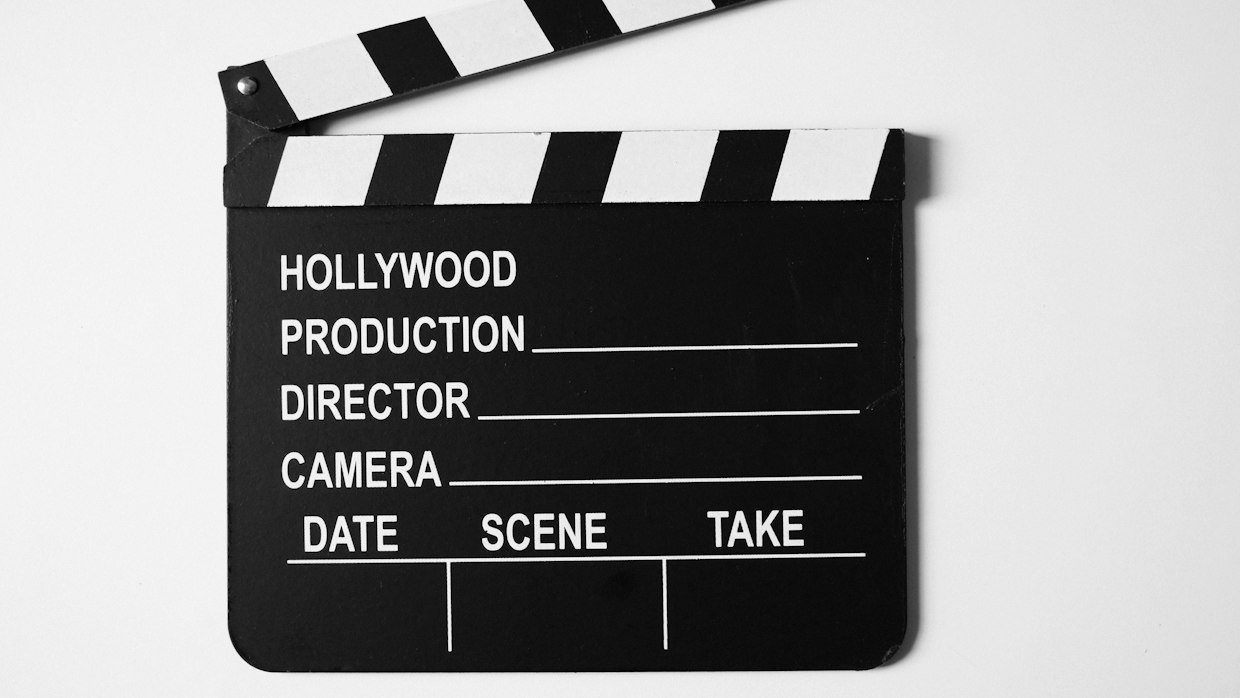A clapperboard resting on a table.