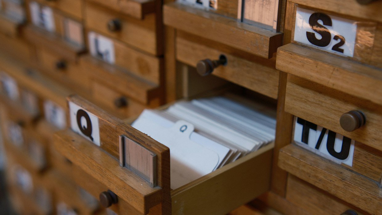 A card index drawer pulled open.