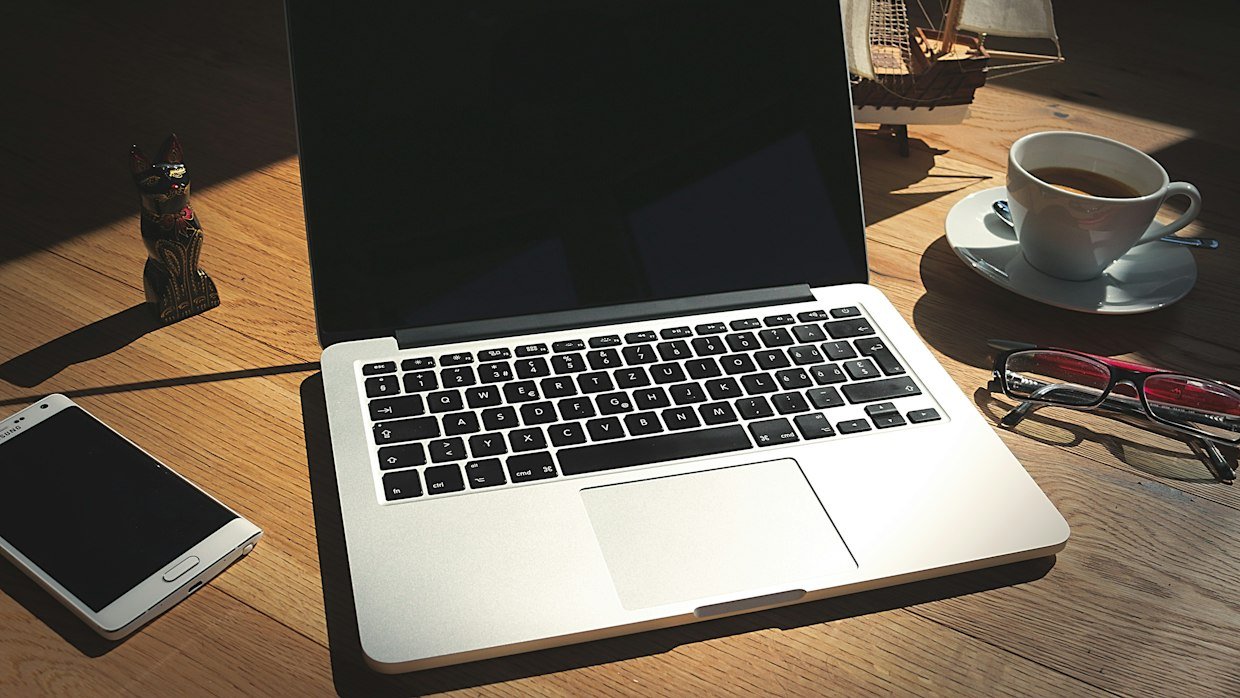 A laptop beside a phone, since the transcript option sits differently on each.