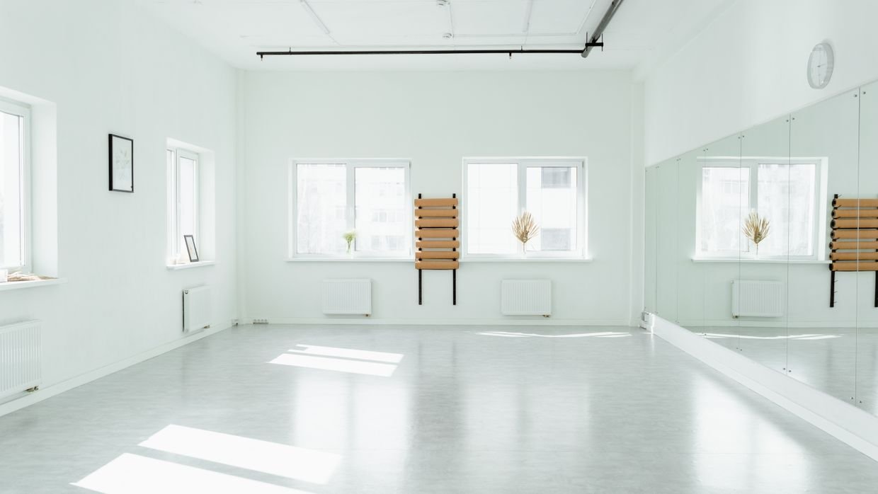 A mirror reflecting an empty room.