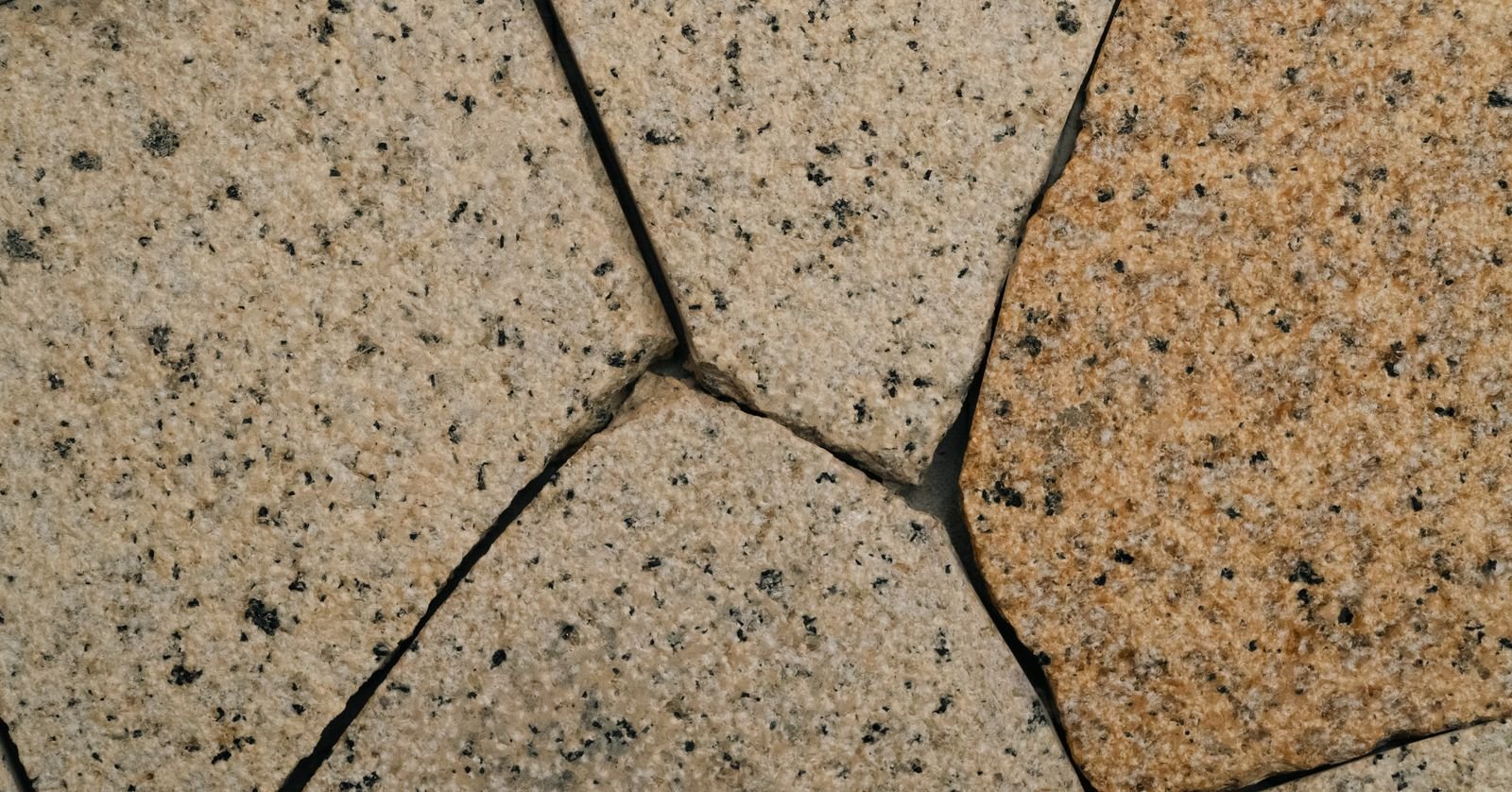 Dark stone tiles arranged in a pattern.