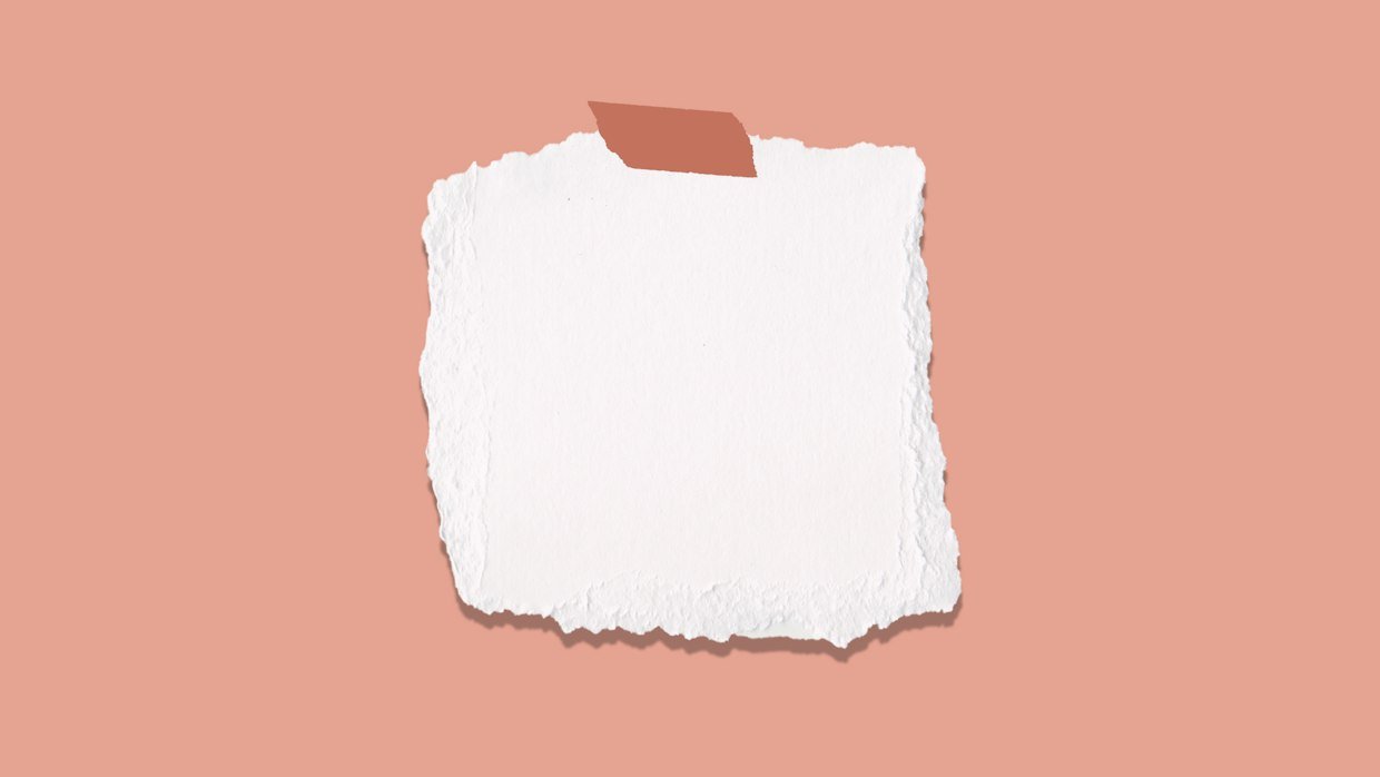 A small note card beside a thick document.