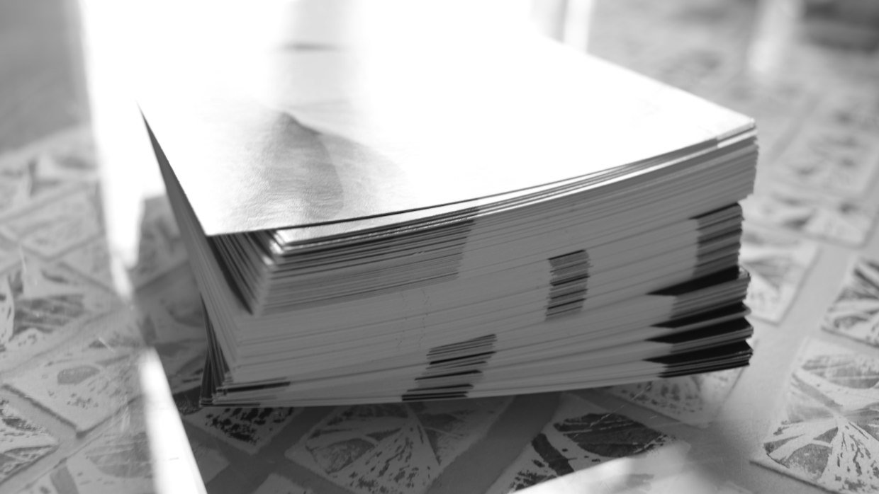 A thick stack of printed pages on a desk.