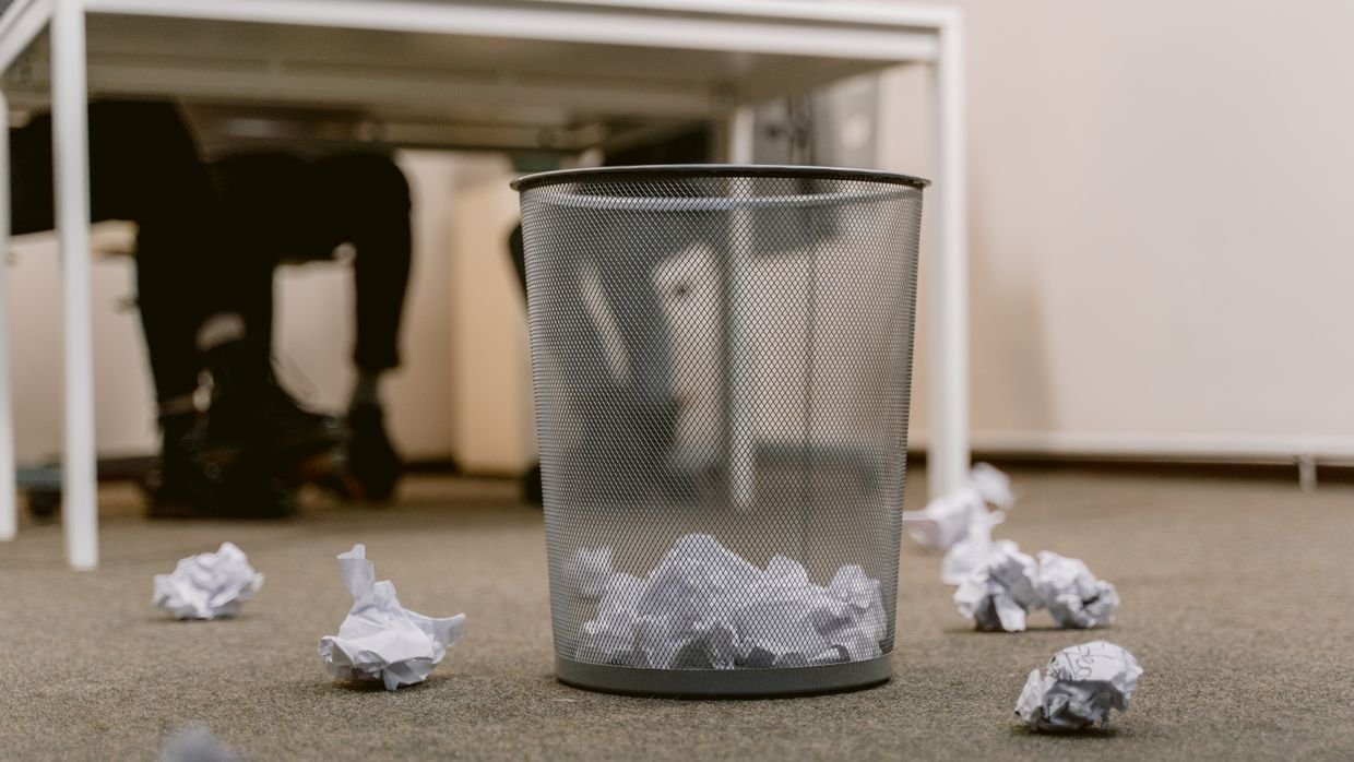 Loose papers scattered across a floor.