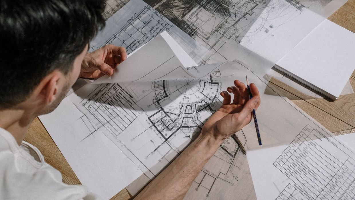 An architectural blueprint spread on a table.