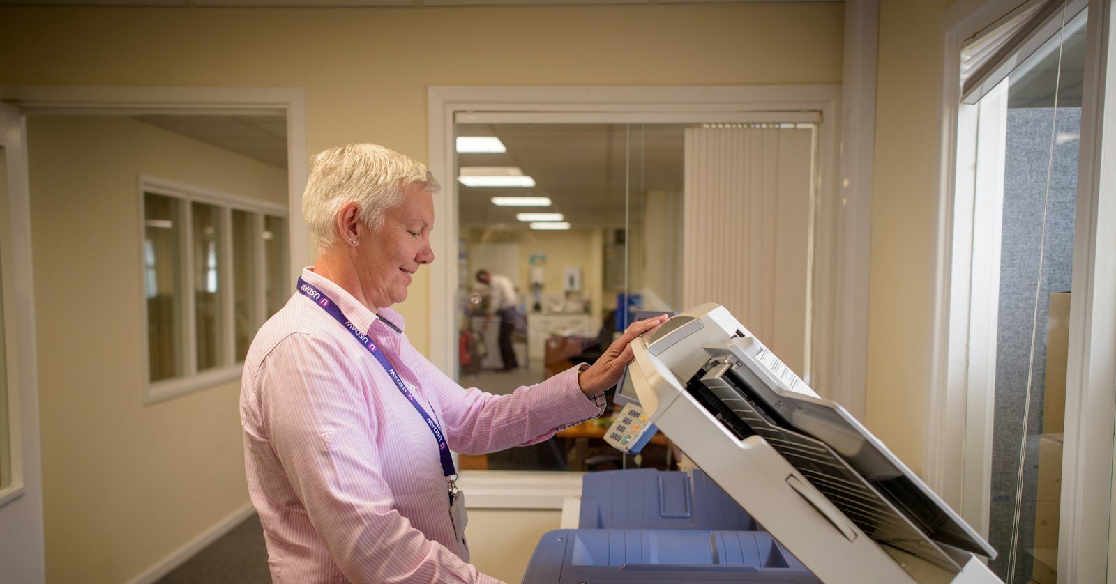 A printer feeding out a sheet of paper.