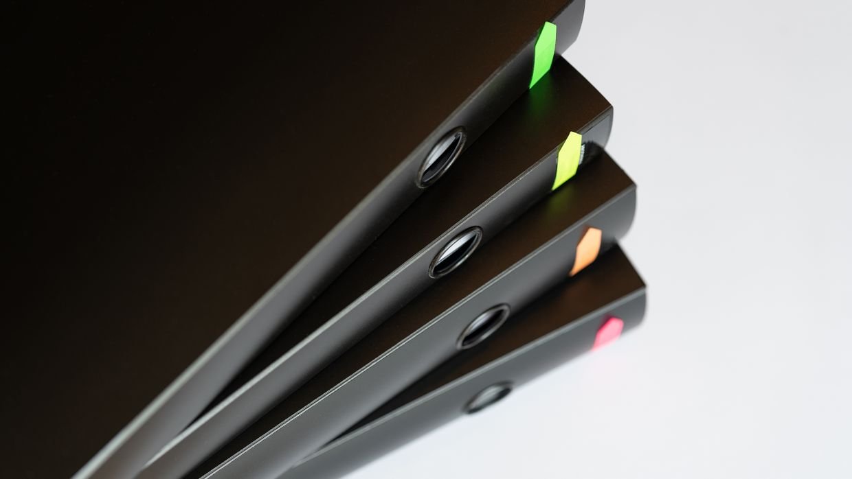 Numbered dividers inside a ring binder.