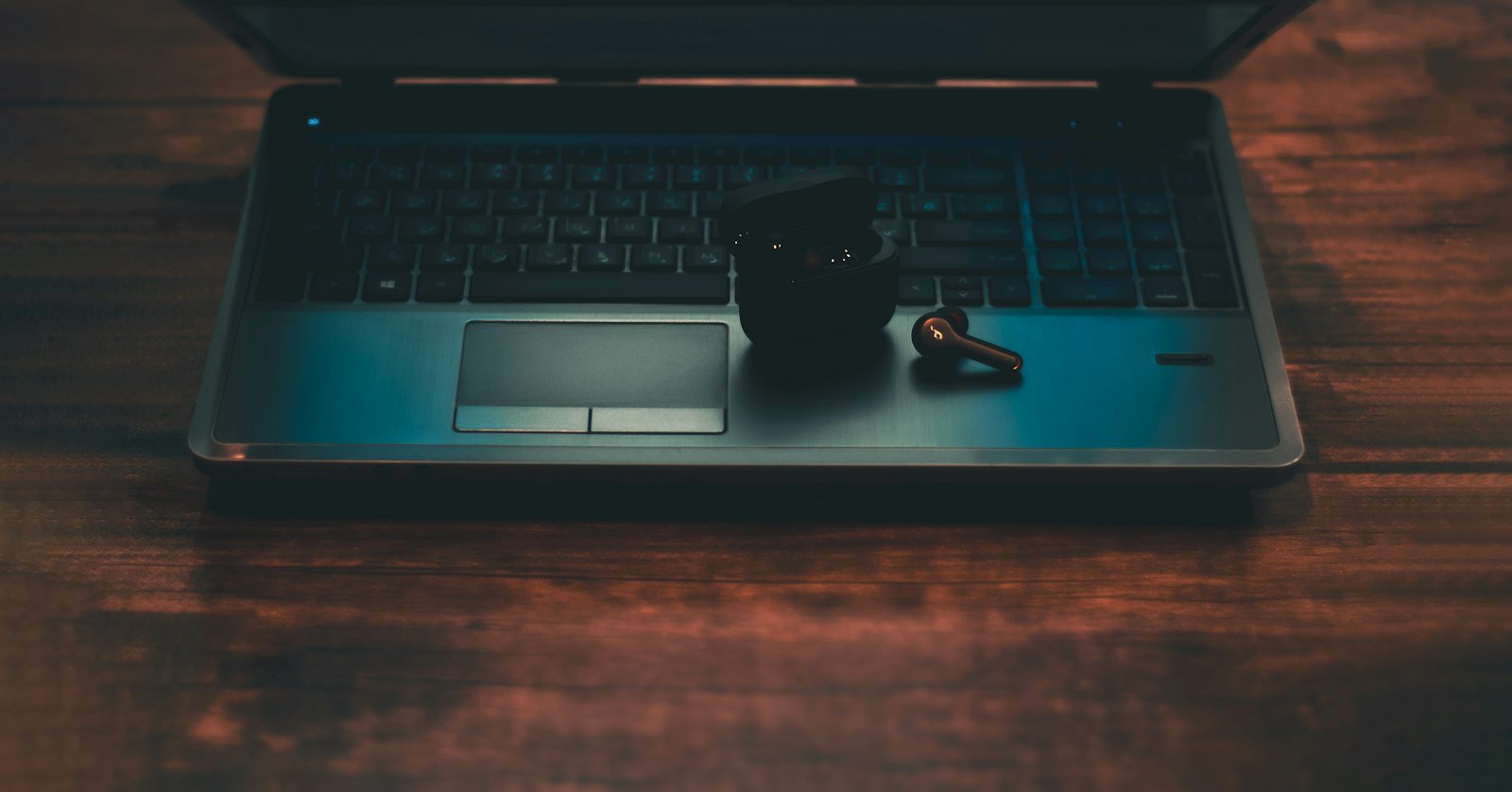 A padlock resting on a laptop keyboard.