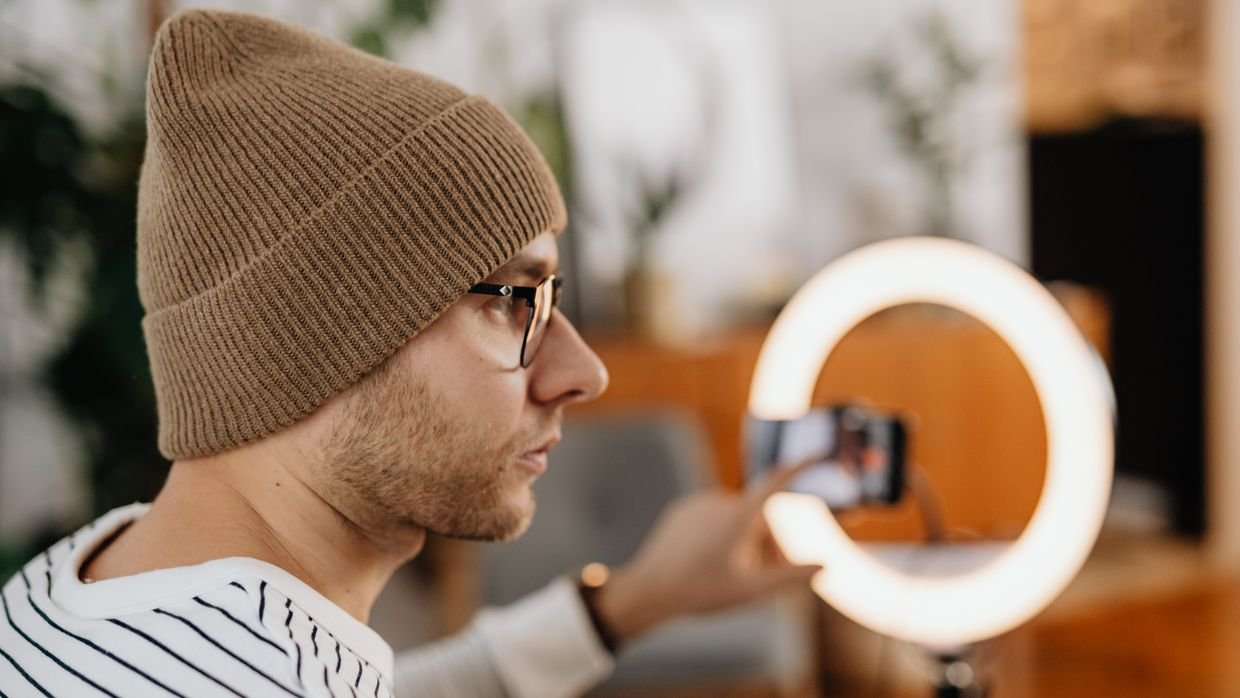 A creator recording to camera, where a sponsorship disclosure may be spoken or only shown on screen.