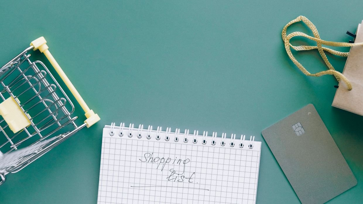 A notebook with a handwritten list, for reading a review summary for its conditions and caveats.