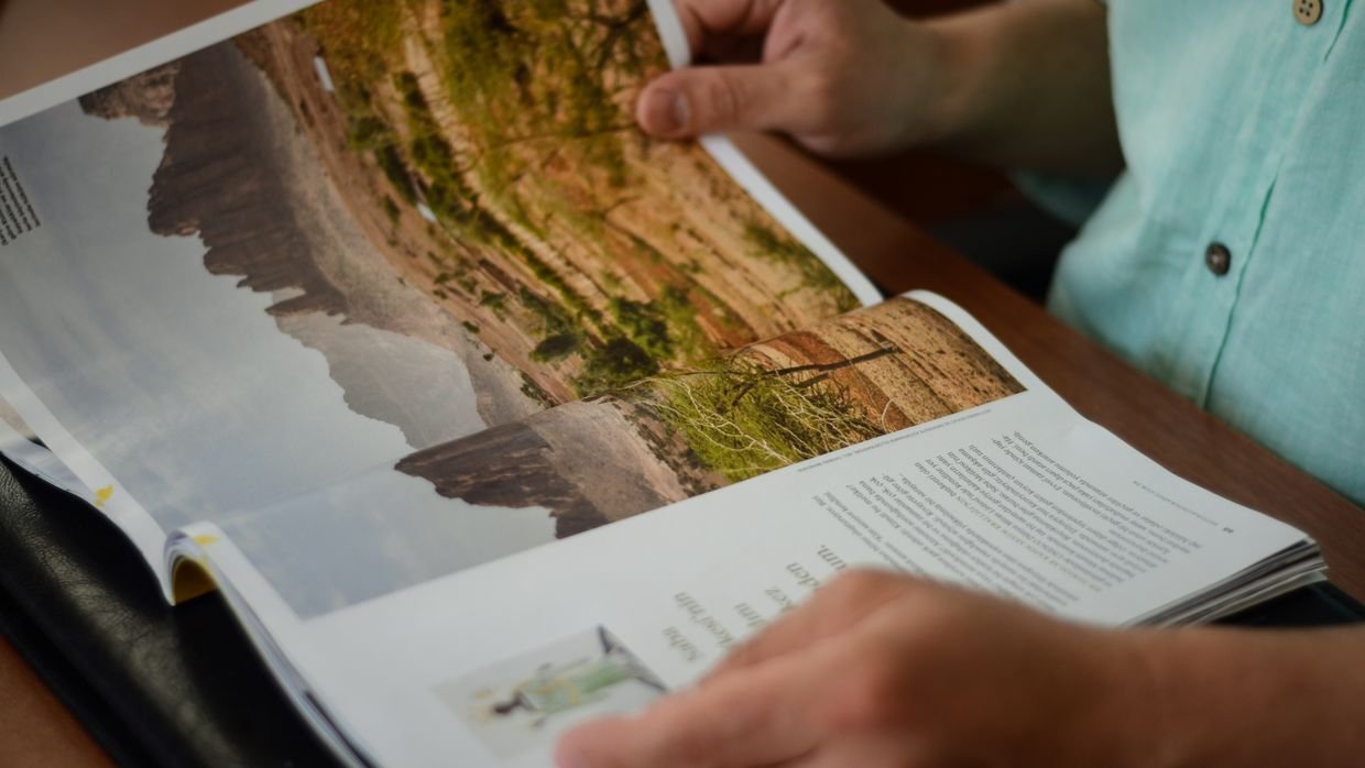 Someone scanning down a printed page.