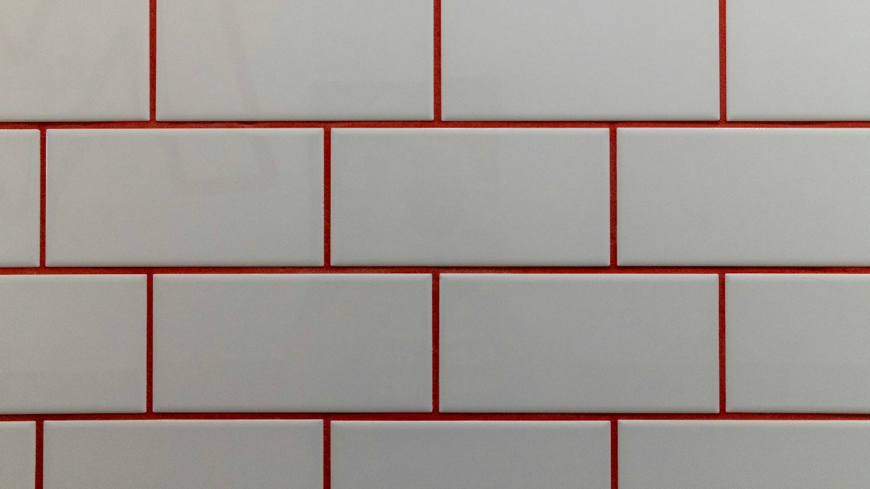 A wall with one tile missing.