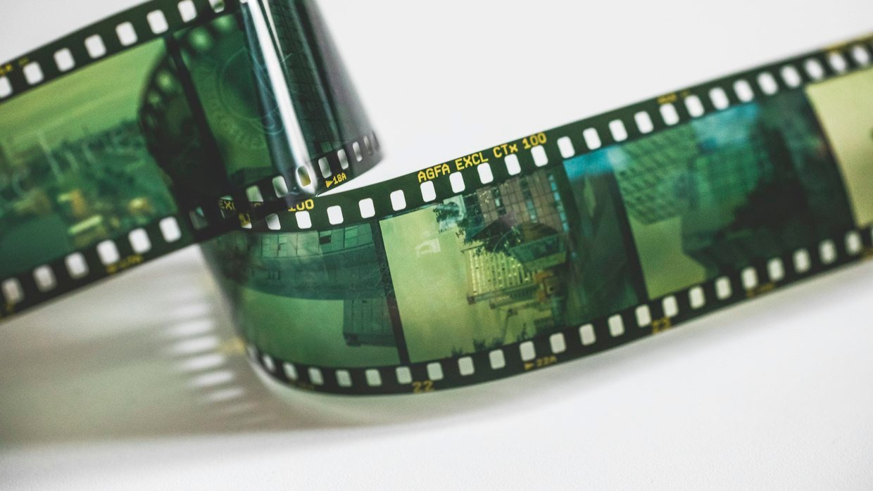 A short strip of film on a white surface.