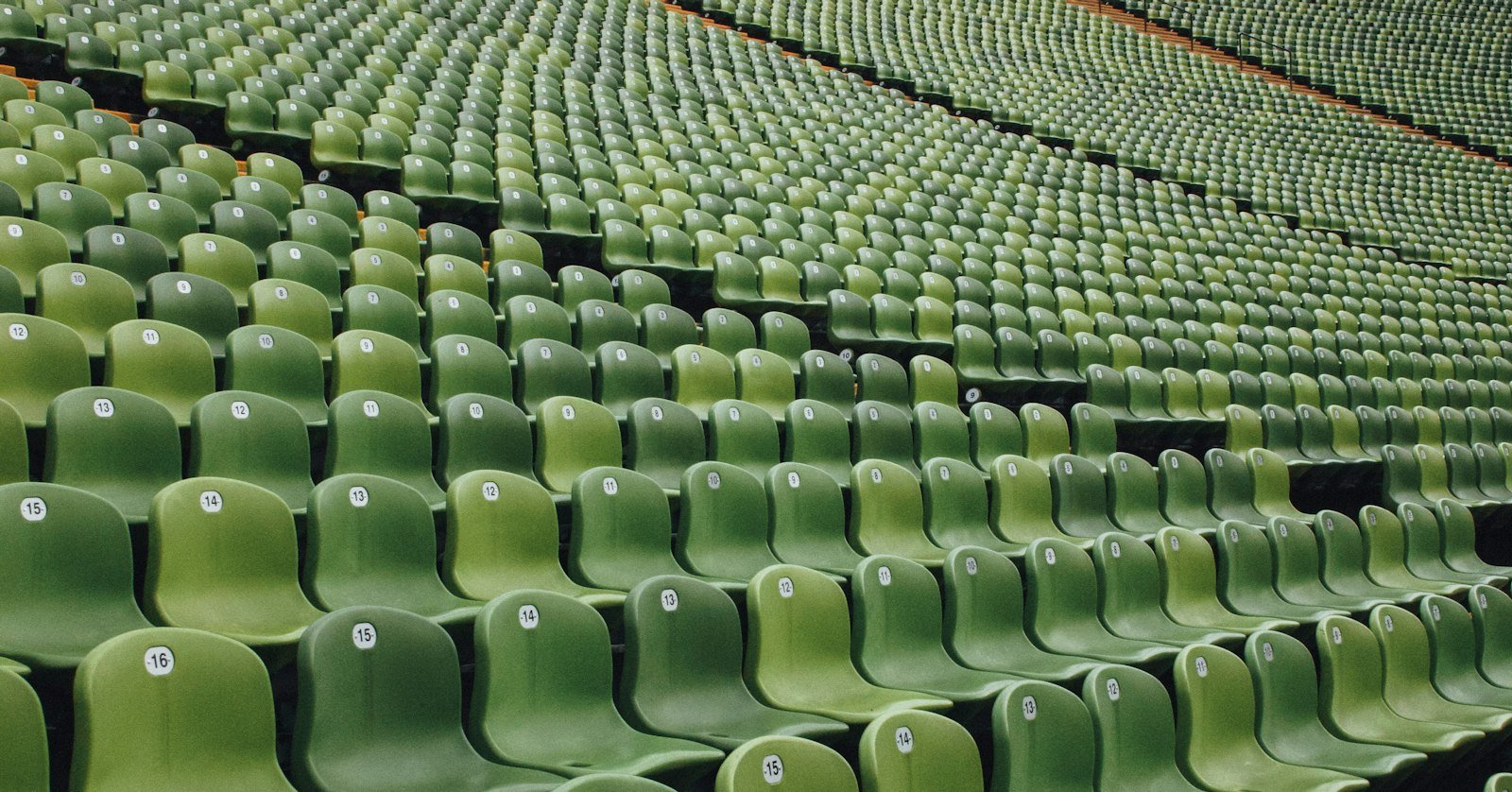 Empty stadium seating at dusk.