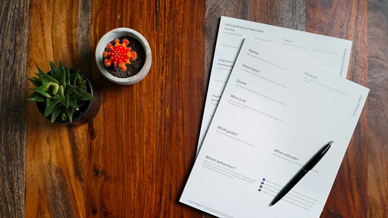 Printed transcript pages on a desk, which is what a caption file becomes without timing.