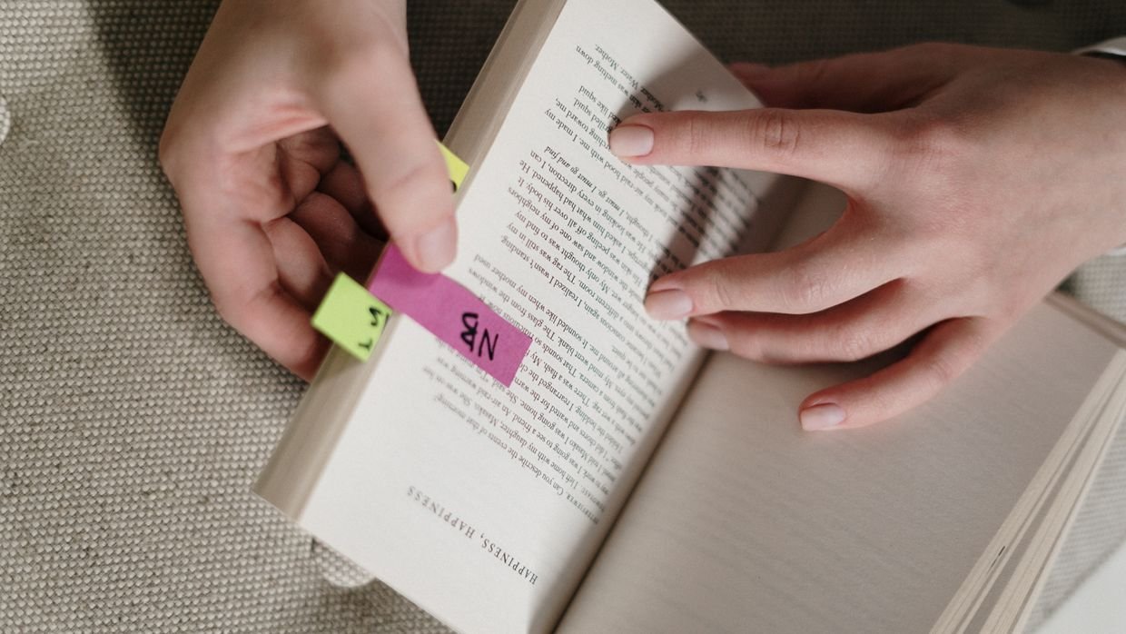 A bookmark placed between pages of a book.