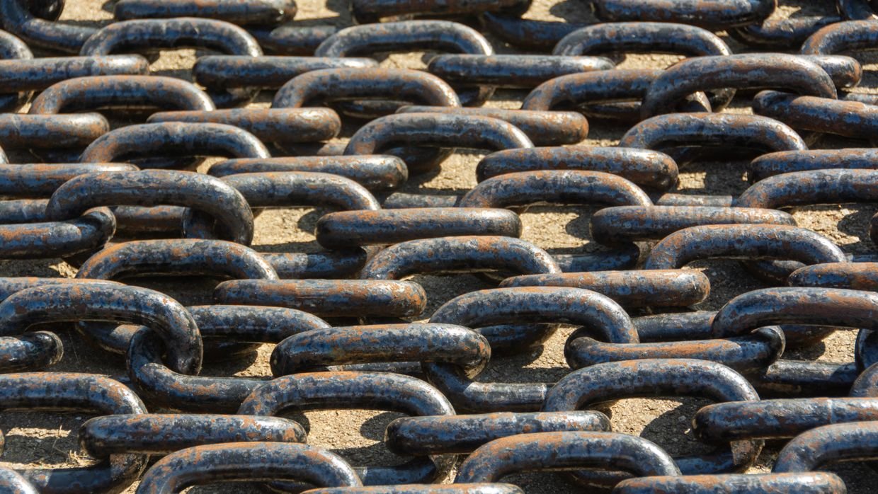 A close view of connected chain links.