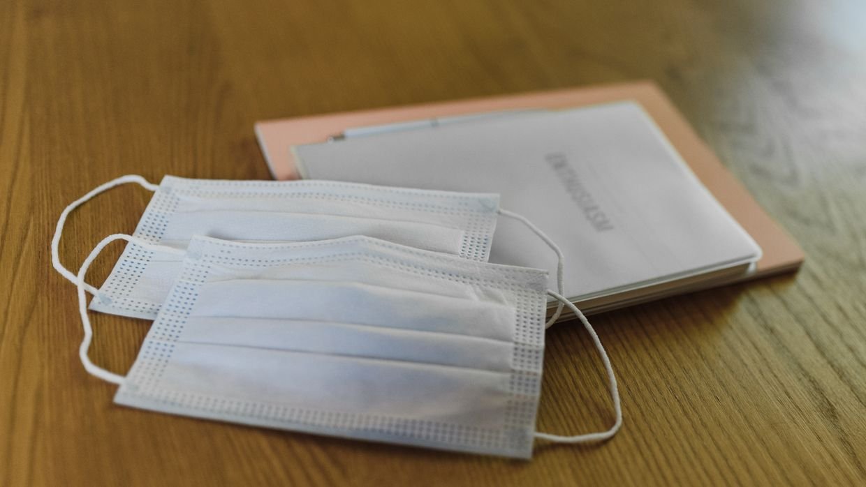 Two documents laid side by side on a desk.