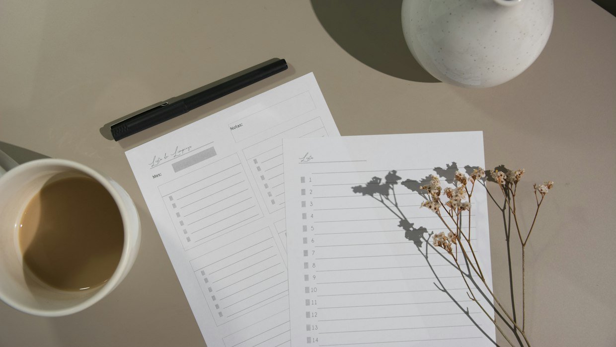 A checklist on a clipboard resting on a desk.
