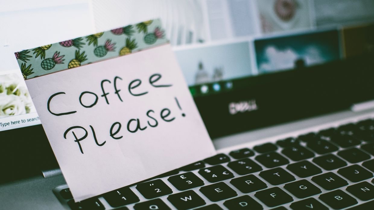 Plain text notes open on a laptop screen.