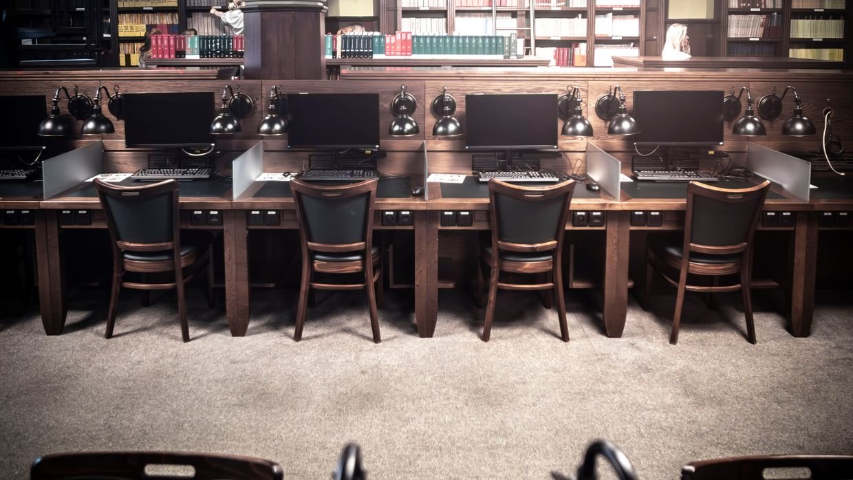 Desks in a library reading room.