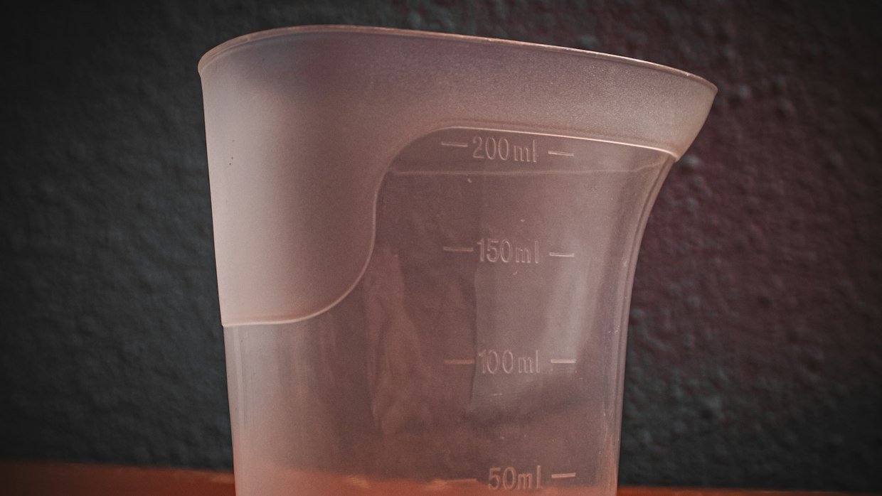 A measuring jug showing marked levels.