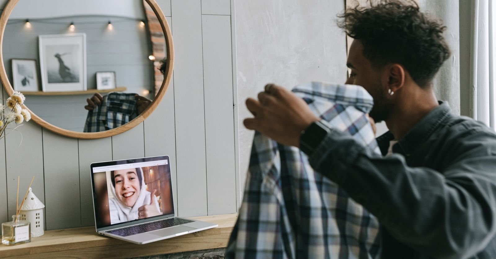 A laptop displaying a grid of video call participants.