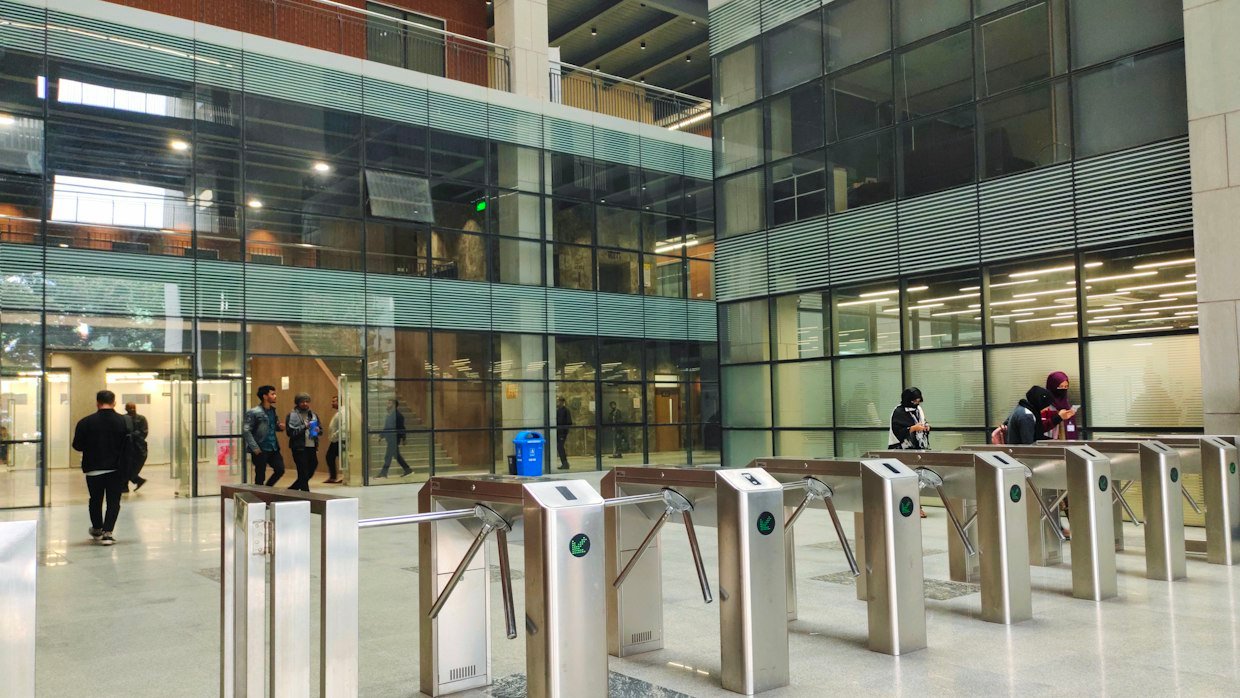 A metal turnstile at an entrance.
