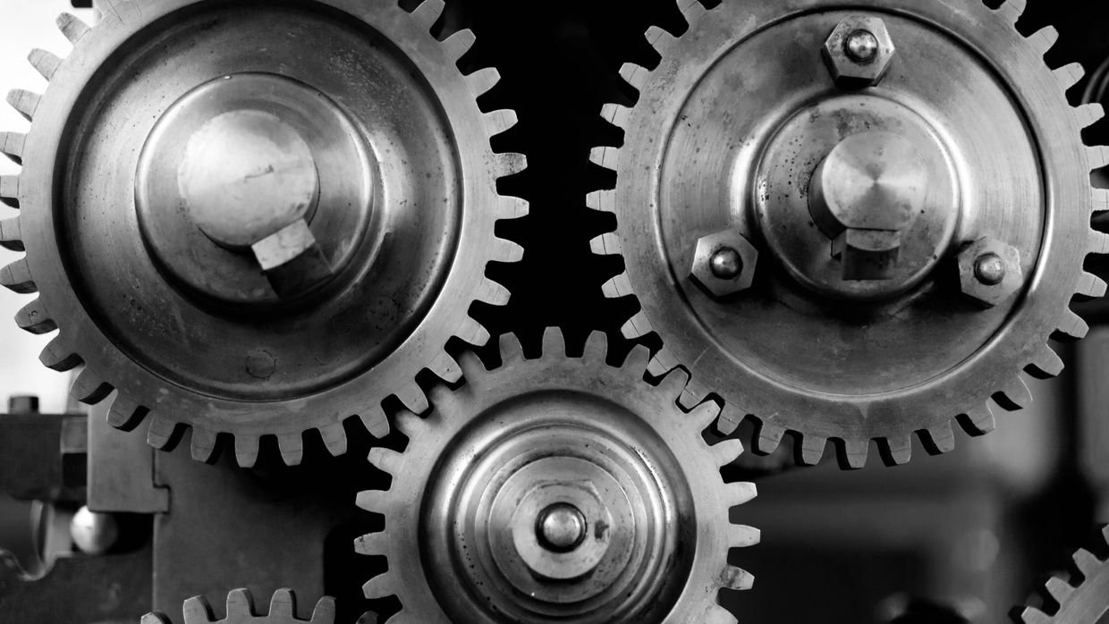 Meshed gears inside a machine.