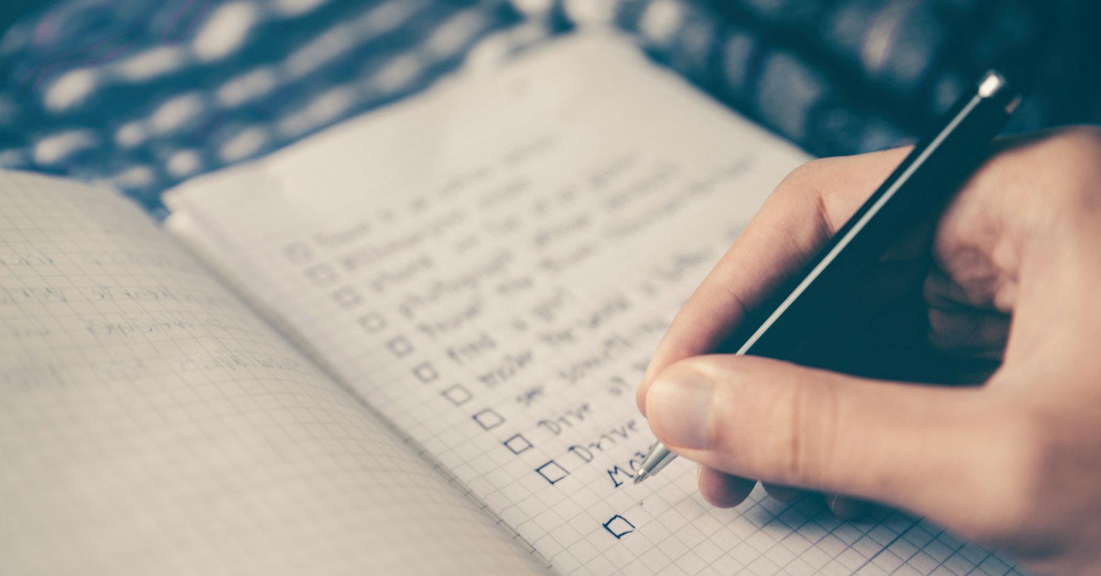 A short bulleted list written in a notebook.