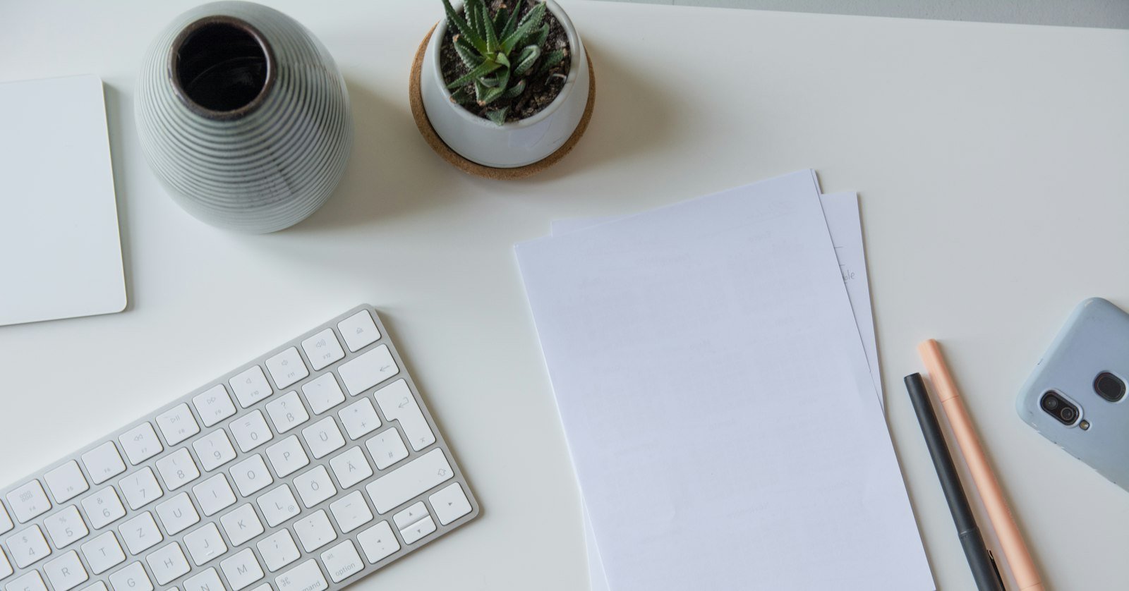 Neatly structured handwritten notes on a desk.