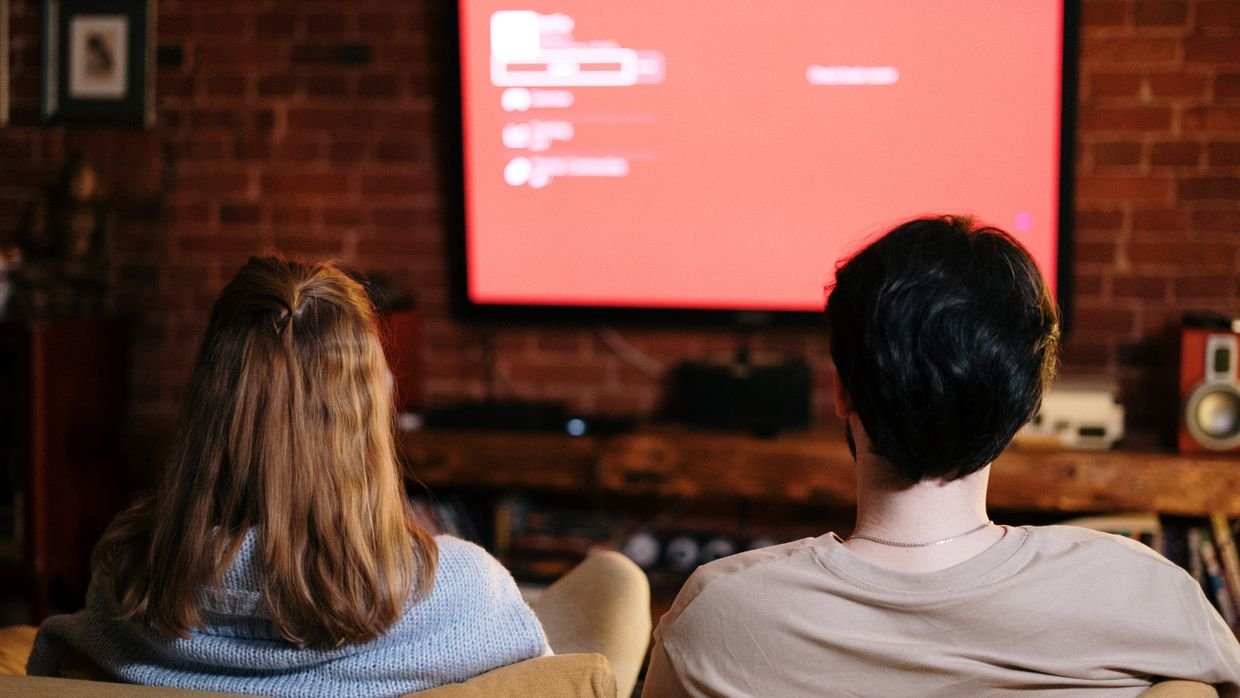 People watching a smart TV, a case where YouTube’s own feature is the easier choice.