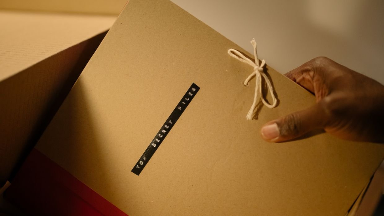 A folder marked confidential on a desk.